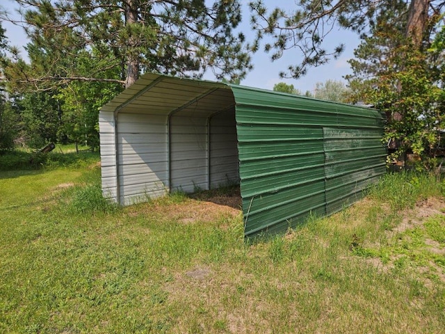 10091 Trengove Rd NW, Bemidji, MN 56601 - view of outbuilding with a carport