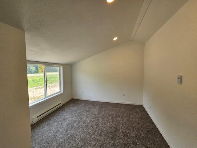 10091 Trengove Rd NW, Bemidji, MN 56601 - spare room featuring a baseboard radiator, carpet floors, lofted ceiling, and recessed lighting