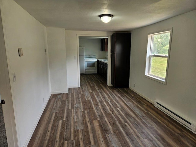 10091 Trengove Rd NW, Bemidji, MN 56601 - spare room with a baseboard heating unit and dark wood finished floors