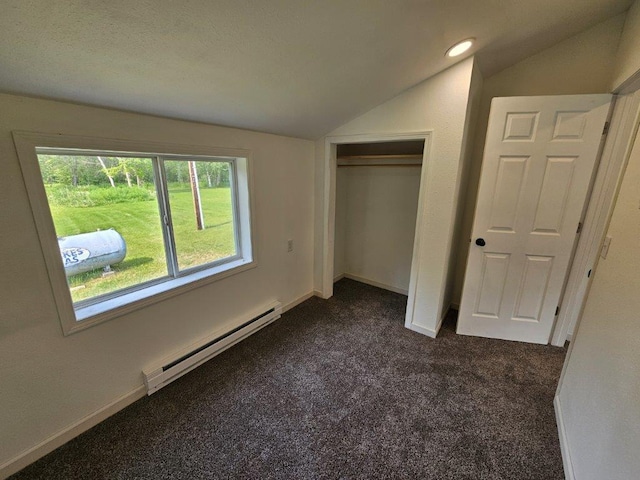 10091 Trengove Rd NW, Bemidji, MN 56601 - unfurnished bedroom featuring a baseboard heating unit, lofted ceiling, dark colored carpet, a closet, and recessed lighting