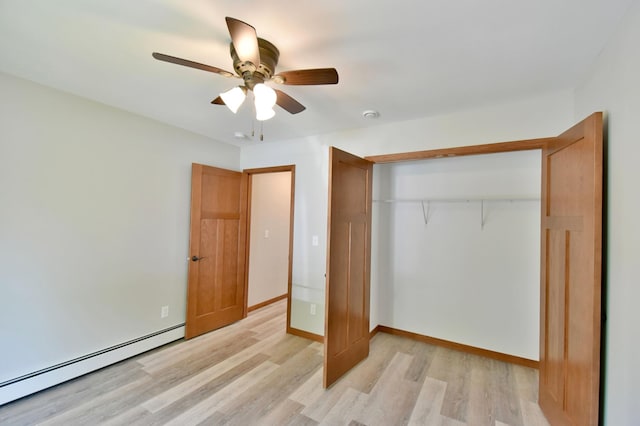 3231/2UNIT3 Fairgrounds Rd N, Alexandria, MN 56308 - unfurnished bedroom featuring a baseboard heating unit, light wood-style flooring, a closet, and a ceiling fan