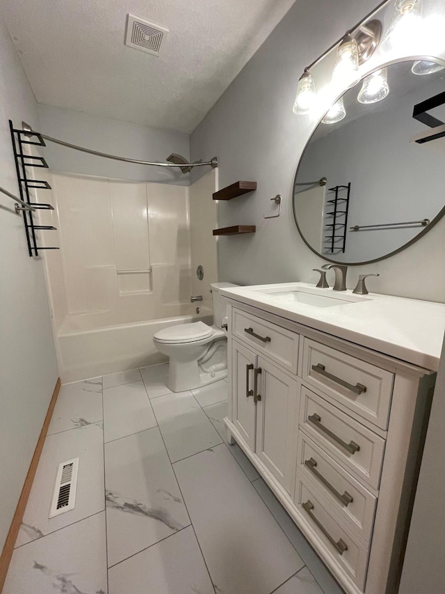 306 10th Ave NW, Dodge Center, MN 55927 - bathroom with marble finish floors, vanity, shower / washtub combination, and a textured ceiling