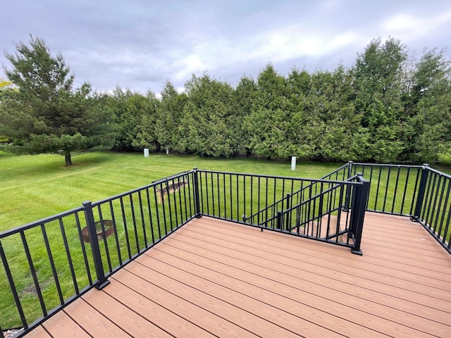 306 10th Ave NW, Dodge Center, MN 55927 - wooden deck featuring a lawn