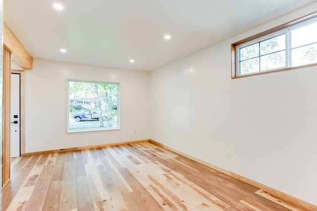 3909 Xerxes Ave S, Minneapolis, MN 55410 - empty room with plenty of natural light, light wood finished floors, and recessed lighting