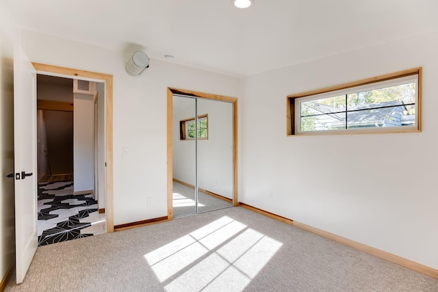 3909 Xerxes Ave S, Minneapolis, MN 55410 - unfurnished bedroom featuring multiple windows, carpet, and a closet
