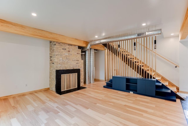 3909 Xerxes Ave S, Minneapolis, MN 55410 - unfurnished living room with wood finished floors, stairs, recessed lighting, and a fireplace