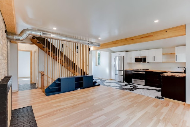 3909 Xerxes Ave S, Minneapolis, MN 55410 - living area with light wood-style floors, recessed lighting, and stairway