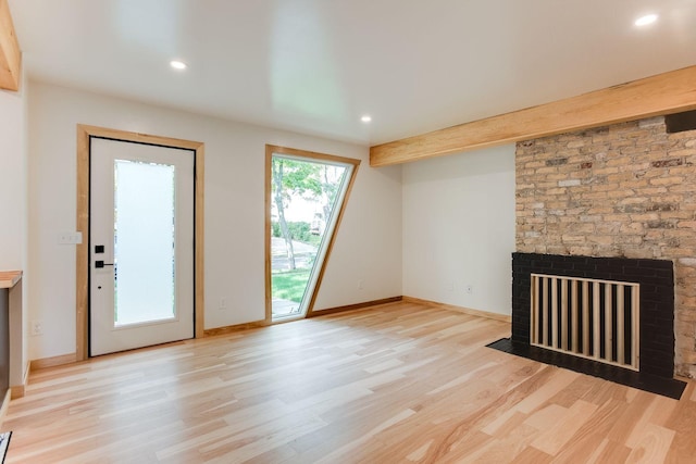 3909 Xerxes Ave S, Minneapolis, MN 55410 - unfurnished living room featuring light wood-type flooring, a fireplace with flush hearth, and recessed lighting