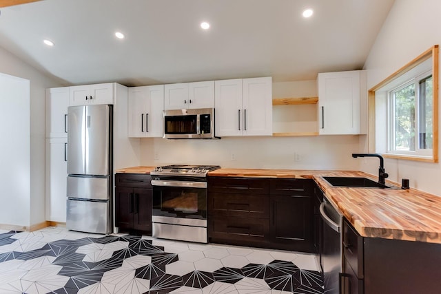 3909 Xerxes Ave S, Minneapolis, MN 55410 - kitchen with wood counters, appliances with stainless steel finishes, open shelves, white cabinets, and lofted ceiling