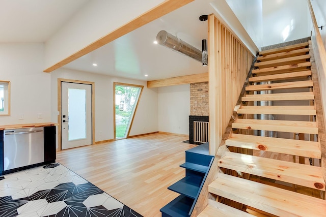 3909 Xerxes Ave S, Minneapolis, MN 55410 - staircase featuring recessed lighting, a fireplace, and wood finished floors
