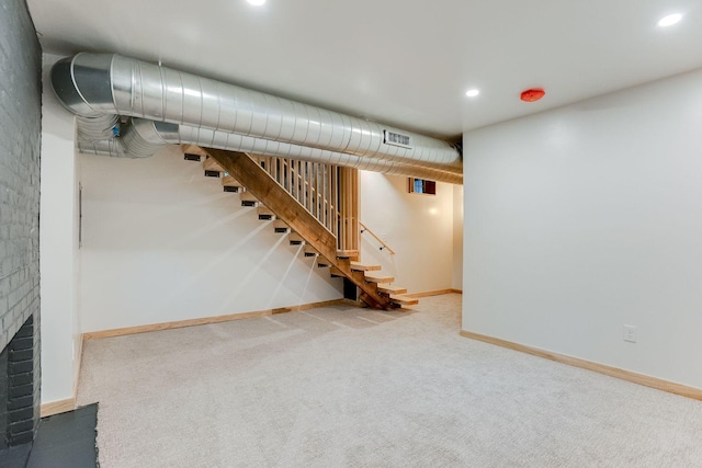 3909 Xerxes Ave S, Minneapolis, MN 55410 - finished below grade area featuring carpet, stairs, a brick fireplace, and recessed lighting