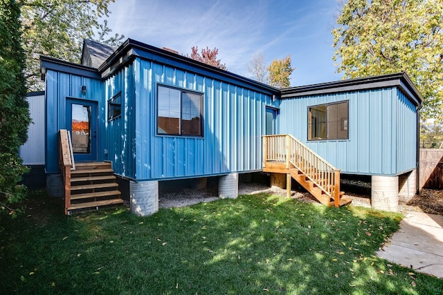 3909 Xerxes Ave S, Minneapolis, MN 55410 - back of house featuring a lawn and board and batten siding
