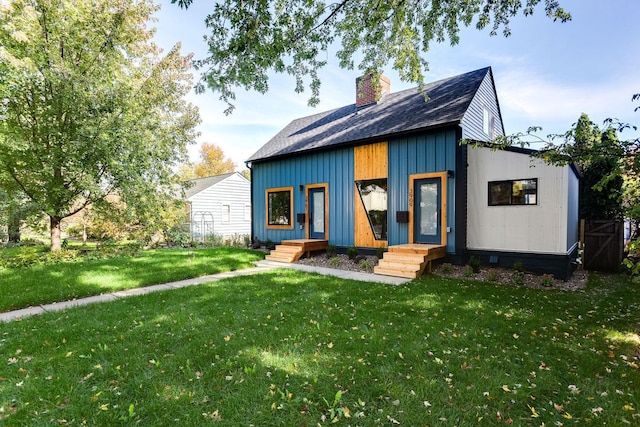3909 Xerxes Ave S, Minneapolis, MN 55410 - view of front of home with a front lawn, a chimney, and a shingled roof