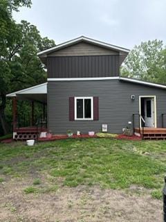 40815 Shadow Dr, Clitherall, MN 56524 - back of property with a yard and a wooden deck