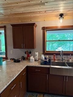 40815 Shadow Dr, Clitherall, MN 56524 - kitchen featuring plenty of natural light, wood ceiling, light stone countertops, and a peninsula