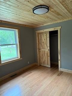 40815 Shadow Dr, Clitherall, MN 56524 - unfurnished bedroom with wood ceiling, light wood finished floors, and a closet
