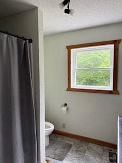 40815 Shadow Dr, Clitherall, MN 56524 - bathroom featuring a shower with curtain and a textured ceiling