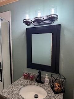 40815 Shadow Dr, Clitherall, MN 56524 - bathroom with vanity, a chandelier, and a shower