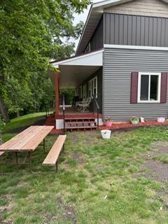 40815 Shadow Dr, Clitherall, MN 56524 - view of side of home featuring a lawn