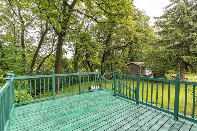 505 1st Ave SE, Pelican Rapids, MN 56572 - deck featuring an outbuilding and a yard
