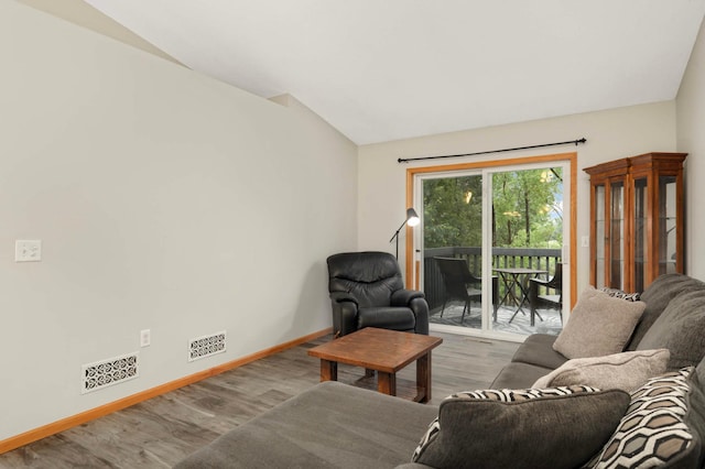 2721 230th Ct NW, Saint Francis, MN 55070 - living room featuring vaulted ceiling and wood finished floors