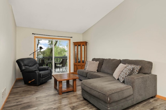2721 230th Ct NW, Saint Francis, MN 55070 - living room featuring wood finished floors and lofted ceiling