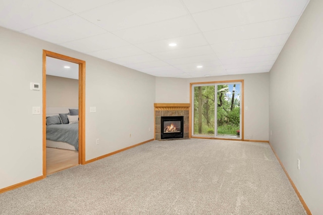2721 230th Ct NW, Saint Francis, MN 55070 - unfurnished living room with carpet, a fireplace, and recessed lighting