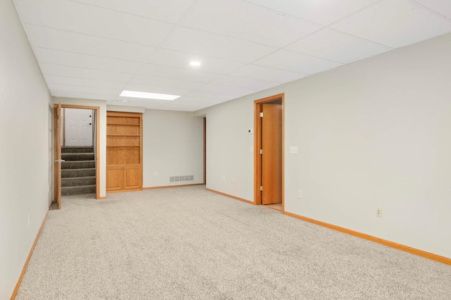 2721 230th Ct NW, Saint Francis, MN 55070 - finished below grade area featuring stairs, light carpet, and a paneled ceiling