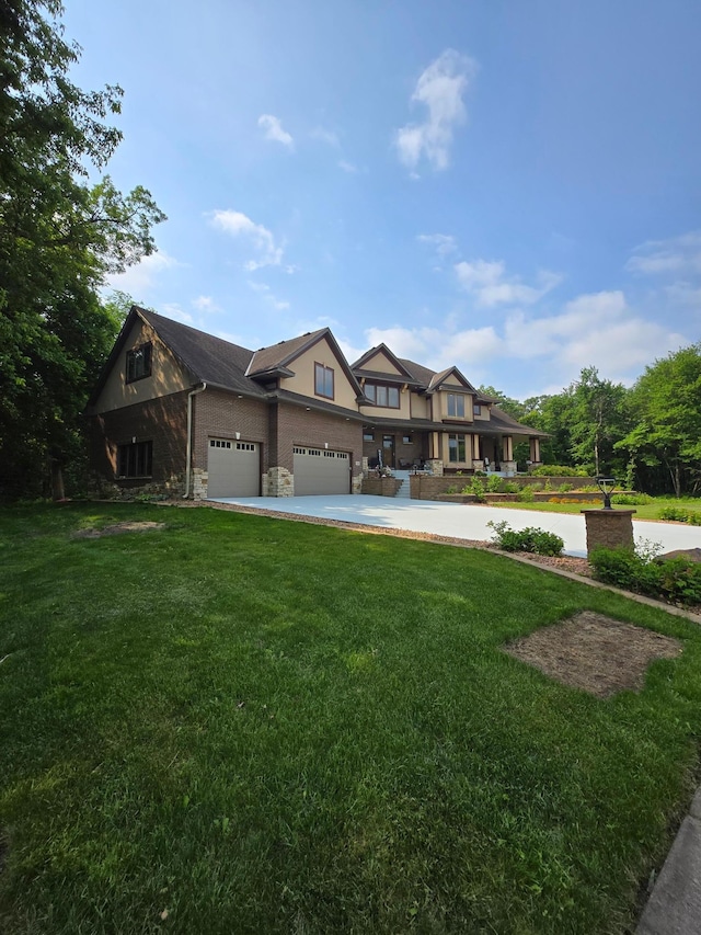 716 169th Ln NE, Ham Lake, MN 55304 - tudor home with a front lawn, stone siding, driveway, and a garage