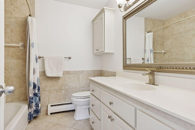 5410 Three Points Blvd Unit 435, Mound, MN 55364 - bathroom featuring baseboard heating, vanity, tile patterned flooring, tile walls, and shower / bathtub combination with curtain