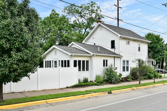231 Mark St, Winona, MN 55987 - view of front of property with a shingled roof and a chimney