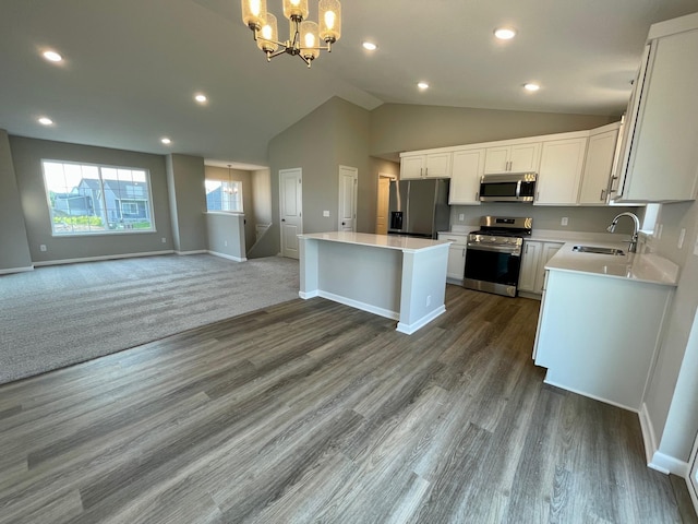 9773 32nd St NE, Saint Michael, MN 55376 - kitchen with stainless steel appliances, open floor plan, a chandelier, a kitchen island, and lofted ceiling