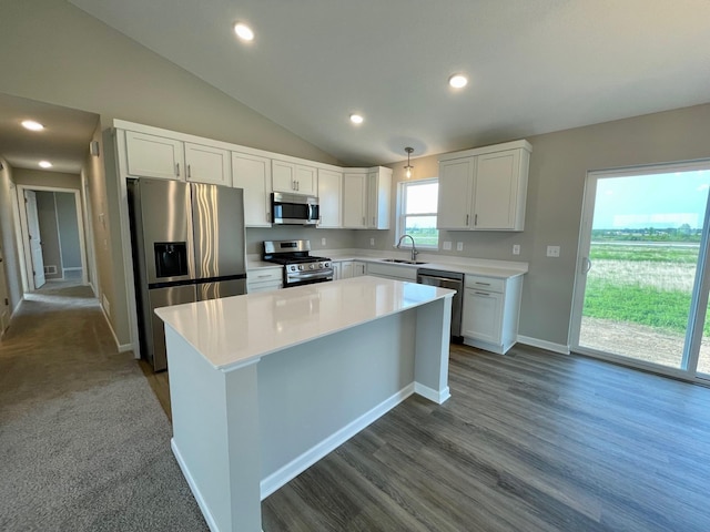 9773 32nd St NE, Saint Michael, MN 55376 - kitchen featuring stainless steel appliances, white cabinets, vaulted ceiling, light countertops, and a center island