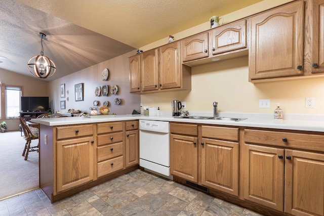 1715 Aspen Ln, Fergus Falls, MN 56537 - kitchen featuring white dishwasher, a peninsula, a textured ceiling, light countertops, and hanging light fixtures