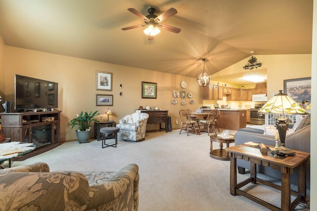 1715 Aspen Ln, Fergus Falls, MN 56537 - living area with light colored carpet, vaulted ceiling, a ceiling fan, and a chandelier