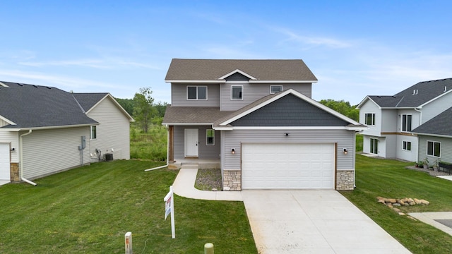 991 45th Ave NE, Saint Cloud, MN 56304 - view of front facade with a front lawn, driveway, stone siding, and a garage