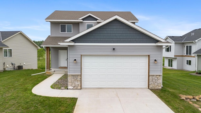 991 45th Ave NE, Saint Cloud, MN 56304 - view of front of home featuring driveway, a front yard, stone siding, and an attached garage