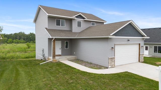 991 45th Ave NE, Saint Cloud, MN 56304 - view of front facade with an attached garage, roof with shingles, concrete driveway, and a front yard