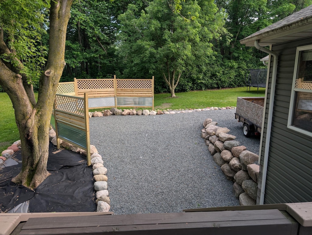 8240 Ochoa Ct NE, Otsego, MN 55330 - view of yard featuring a trampoline