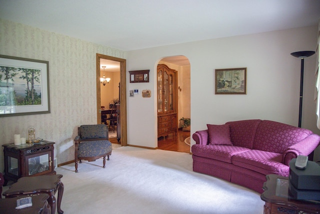 58280 County Road 21, Zumbro Falls, MN 55991 - carpeted living room with arched walkways and a chandelier