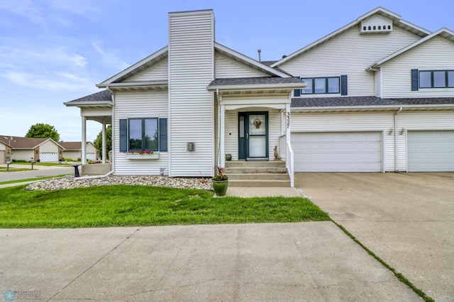 3327 23rd Ave S, Fargo, ND 58103 - view of front of property with driveway, roof with shingles, a front yard, and a garage