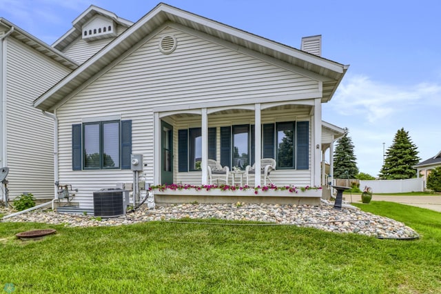 3327 23rd Ave S, Fargo, ND 58103 - rear view of property with a chimney and a yard