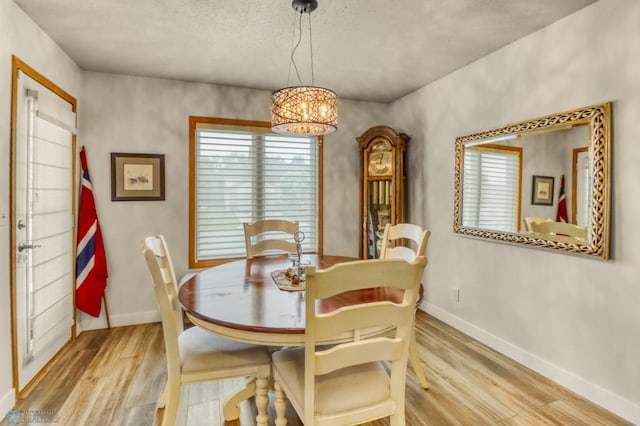 3327 23rd Ave S, Fargo, ND 58103 - dining room with wood finished floors and a chandelier
