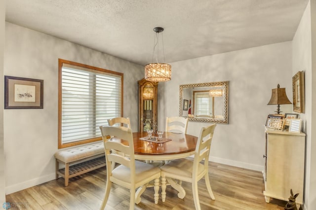 3327 23rd Ave S, Fargo, ND 58103 - dining space featuring light wood-style floors and a chandelier