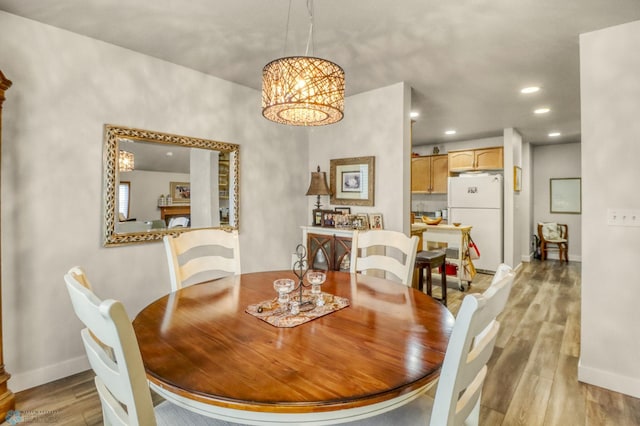 3327 23rd Ave S, Fargo, ND 58103 - dining space featuring light wood finished floors, recessed lighting, and a chandelier