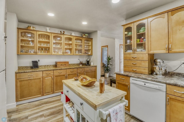 3327 23rd Ave S, Fargo, ND 58103 - kitchen with dishwasher, butcher block countertops, light wood finished floors, glass insert cabinets, and recessed lighting