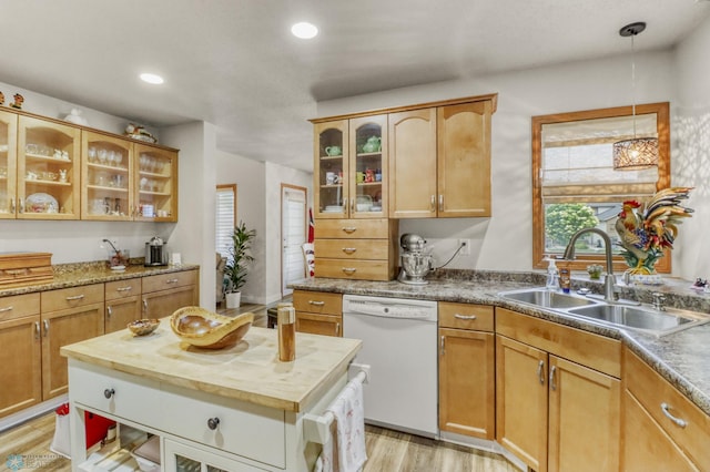 3327 23rd Ave S, Fargo, ND 58103 - kitchen with dishwasher, butcher block counters, light wood-type flooring, decorative light fixtures, and glass insert cabinets