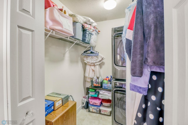 3327 23rd Ave S, Fargo, ND 58103 - spacious closet featuring stacked washing machine and dryer and tile patterned flooring