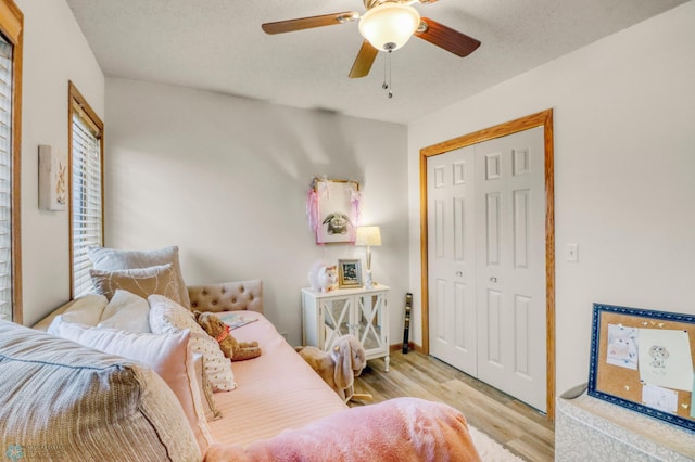 3327 23rd Ave S, Fargo, ND 58103 - bedroom featuring wood finished floors, a closet, a ceiling fan, and a textured ceiling