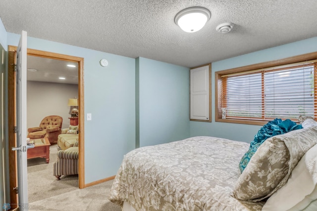 3327 23rd Ave S, Fargo, ND 58103 - bedroom with light colored carpet and a textured ceiling